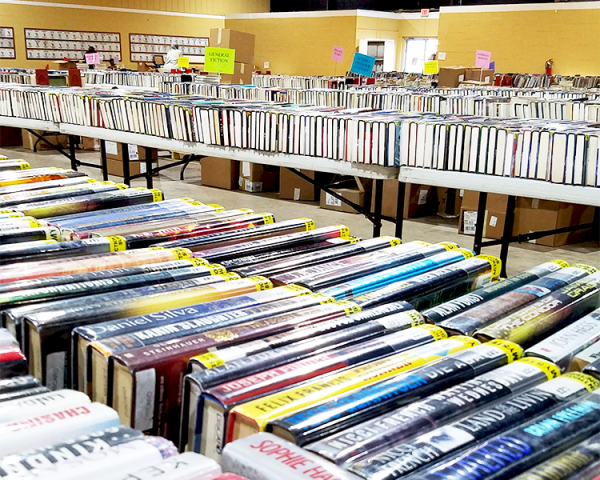 Annual Book Sale image showing books and patrons shopping